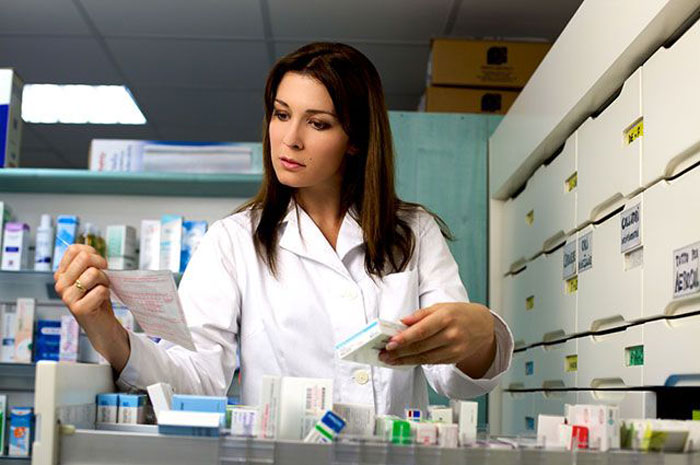 pharmacist with tools in their hands