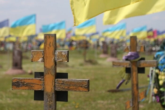 Holodomor Cemetery: broken crosses and wilted flowers