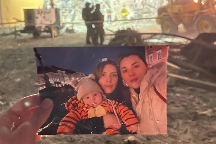 Photo of mother and her son under the rubble