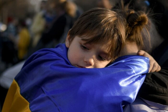 Ukrainian children on a bus to Poland