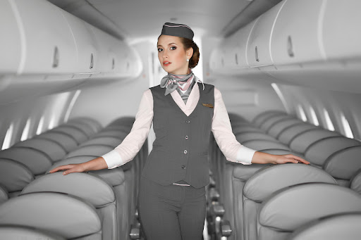 A person serving passengers on a plane