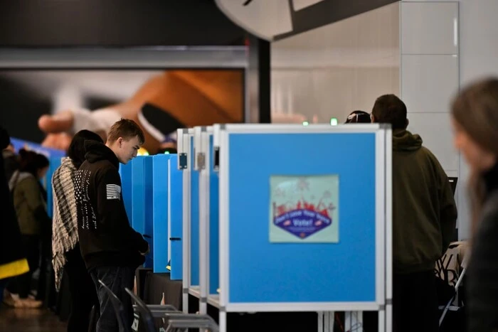 The image shows youth unable to sign the ballots