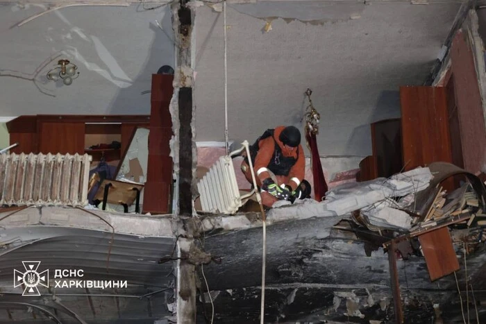 National guards inspect the destroyed apartment building