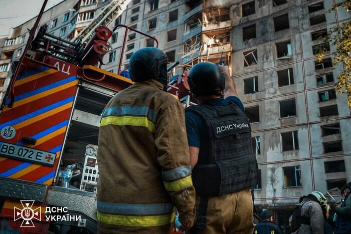 Damaged building with debris in Kharkiv