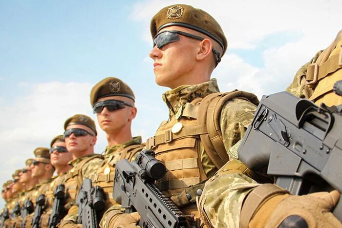 Soldiers in Ukrainian uniforms lined up on the front line