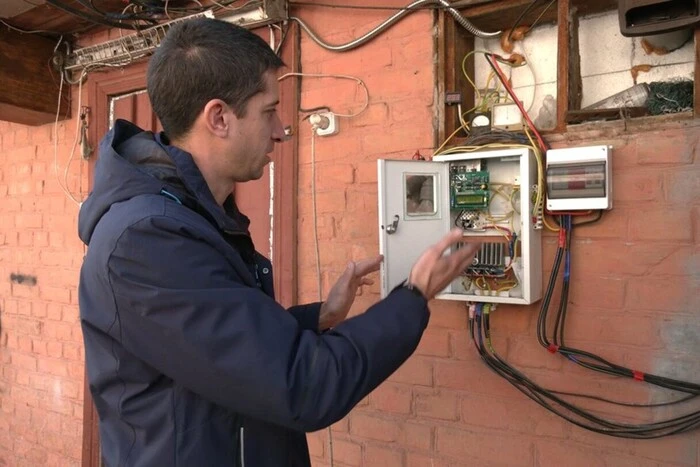 Man repairing solar panel