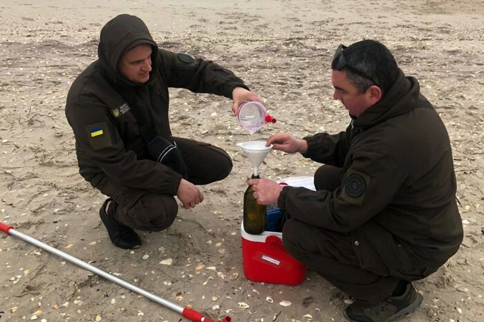 Ecologists are collecting samples of heavy fuel oil for analysis