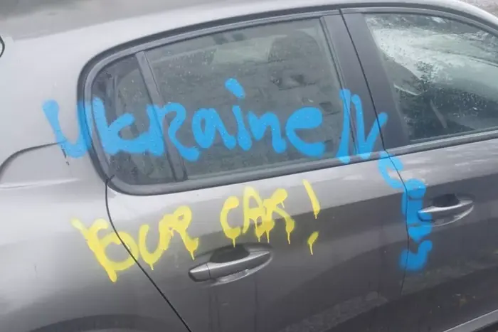 Yellow-blue inscriptions on cars