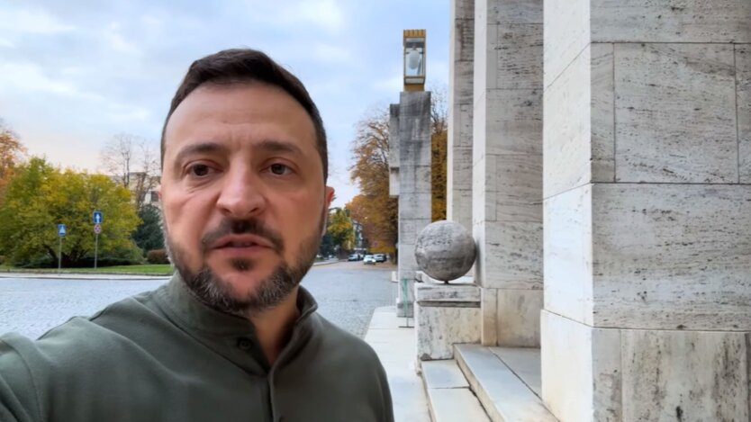 President Zelensky against the background of the Ukrainian flag