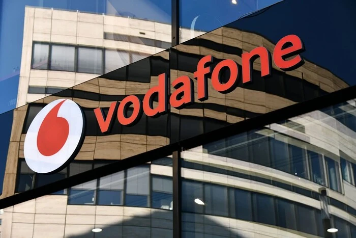 Vodafone logo against the background of another operator